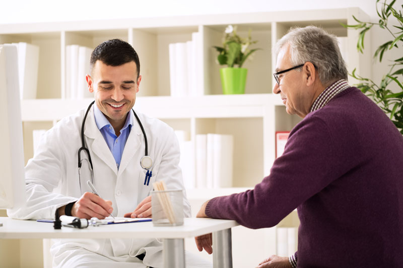Schedule These Health Screenings This Men’s Health Month man talking to his doctor