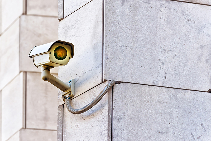 How to Prevent Vandalism at Your Place of Business a security camera on a building