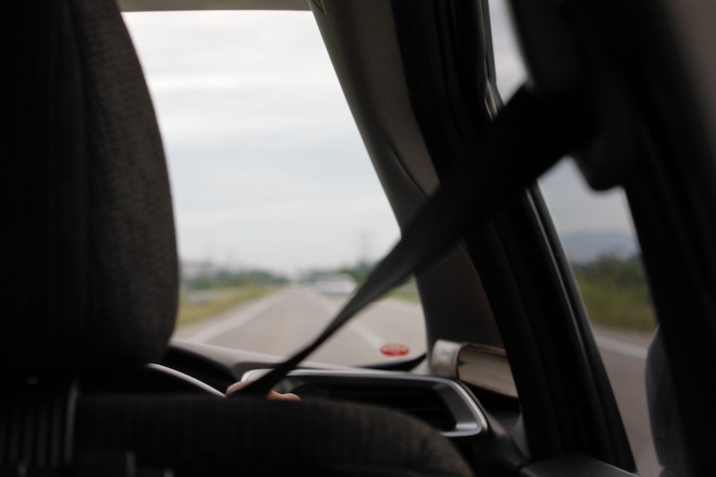 a passenger wearing a seatbelt | How Do Seatbelt Tickets Impact My Auto Insurance Premiums?